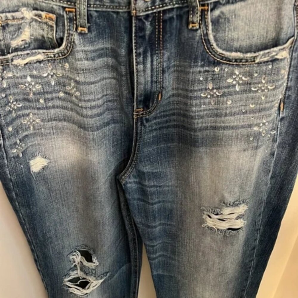 Womens Hollister jeans worn once destroyed and has rhinestones designed under th